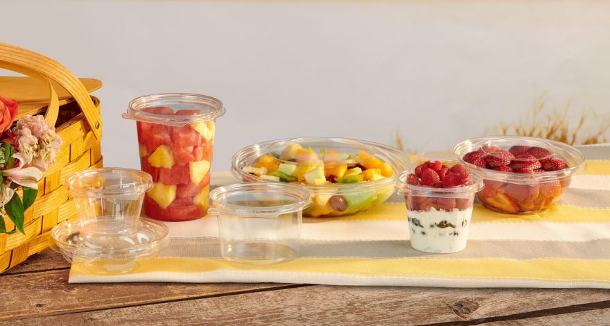 various sized deli containers filled with fruits and yogurts