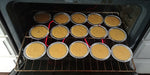 Pineapple upside down cakes - mini's - going in the oven.