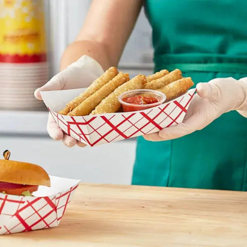 3 lb. compostable food tray with spring rolls and ketchup in it