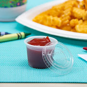 Dart Solo Clear 1 oz. PET Plastic Soufflé Cup Lid - Sleeve of 125 - #PL100N Dart Container
