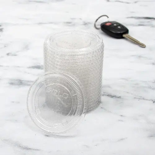 Dart 2 oz. PET Clear Plastic Soufflé Cup Lid - Sleeve of 125 - #PL200N Dart Container