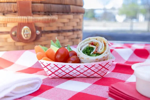 1/2 lb compostable food tray with filled with food truck food