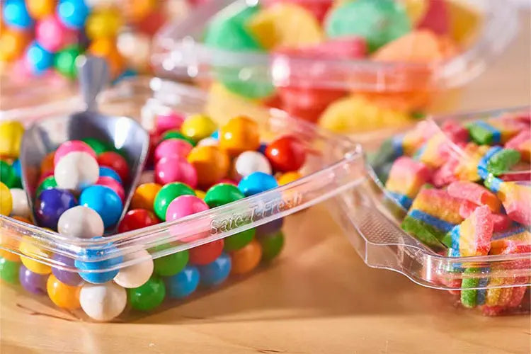 Safe-T-Fresh 32 oz. clamshell deli container with candies